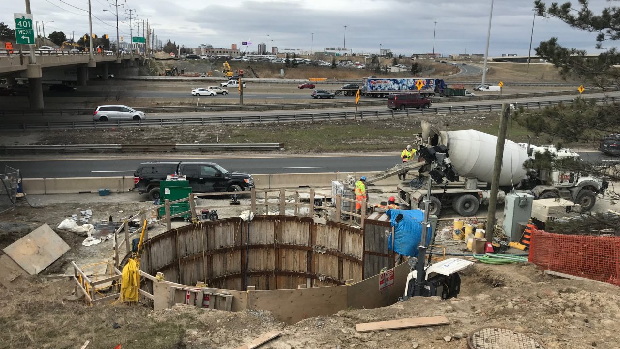 Grouting operations at a shaft beside live Highway 401 traffic in Toronto