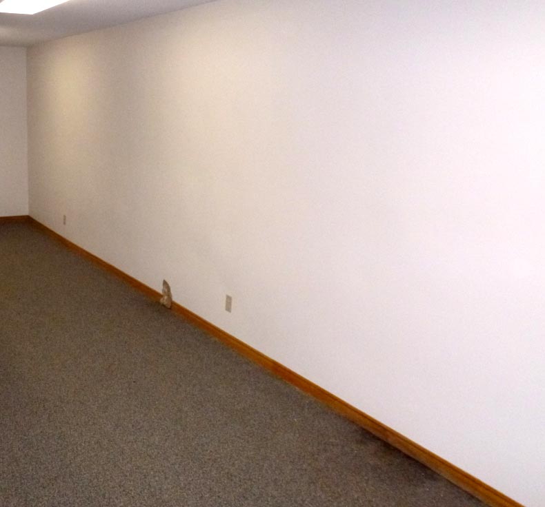 After: finished basement wall reinstated following foundation crack injection