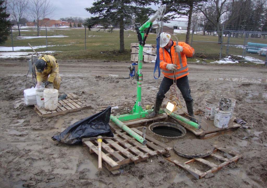 Confined space tripod and retrieval system set up over a manhole at the Tavistock Community Centre