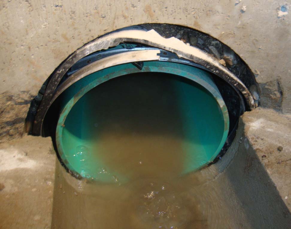 Leaking pipe penetration in a precast manhole before injection grouting