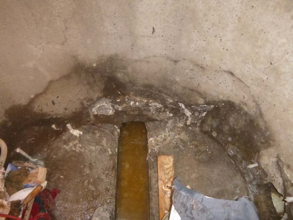 Injection ports and reacted polyurethane resin around a manhole pipe penetration during leak repair